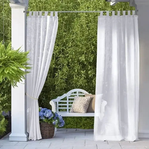 High-quality outdoor curtains with a sheer fabric, ideal for creating a relaxing atmosphere in a Dubai garden.