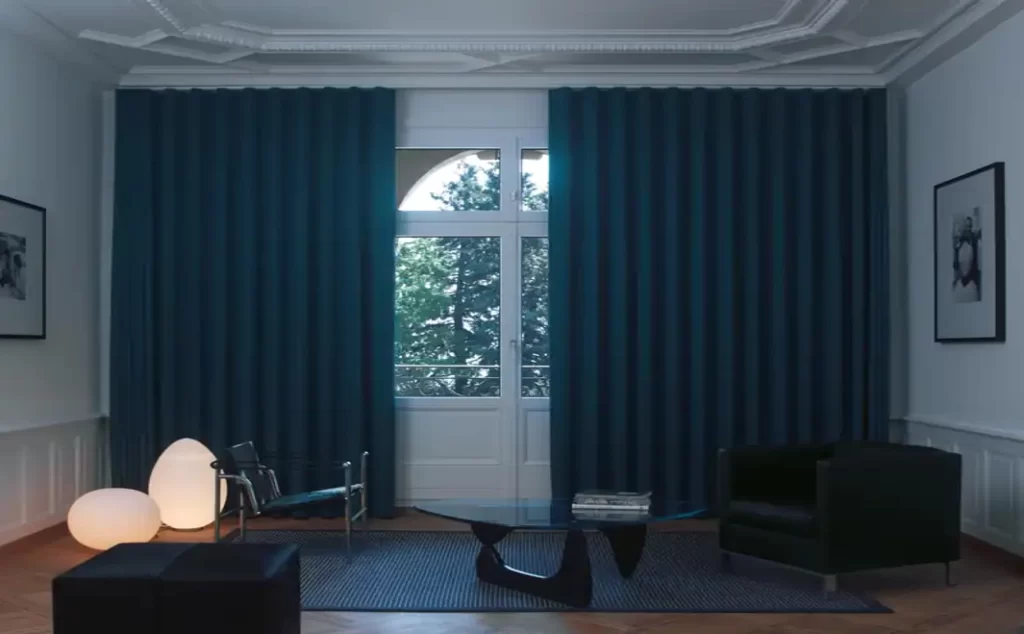 Modern living room with teal wave curtains on a Vama track and black furniture.
