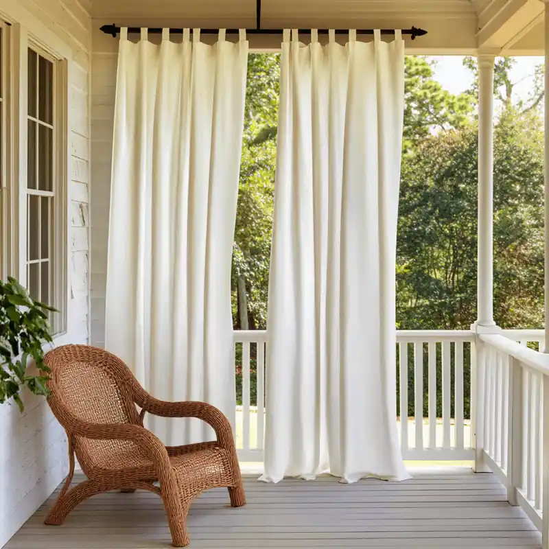 White Linen curtain on a porch with wicker chair