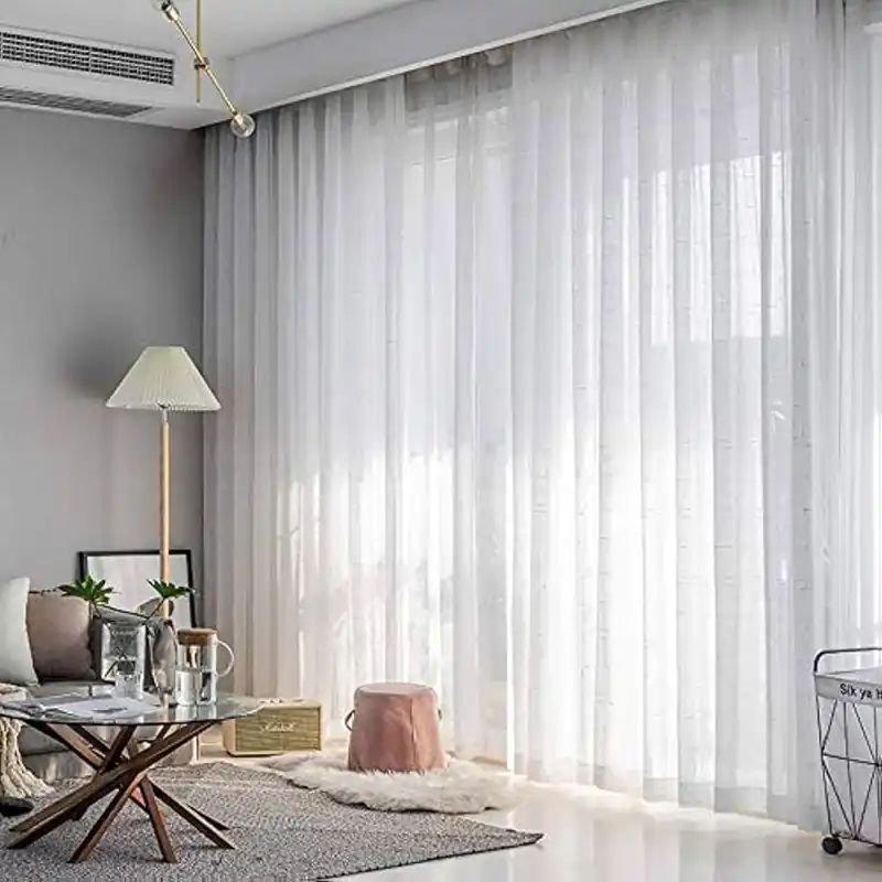White translucent sheer curtains dubai cover a bright window